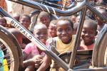 Pictures of some chiildren in Chilaweni, Malawi.  They are looking through the frame of a bicycle ambulance.